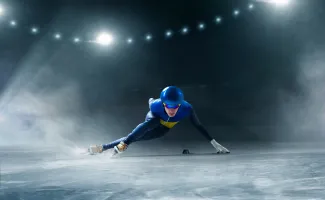 Short track speed skater in ice arena