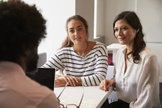 Mother and daughter in business meeting