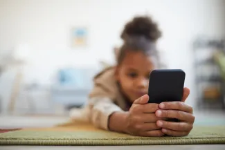 Child using phone online