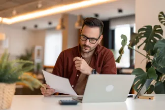 Business man reading new immigration legislation