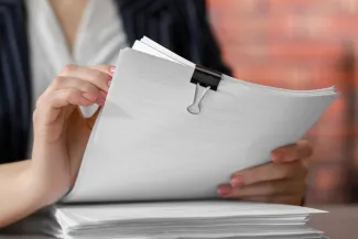 Woman holding documents