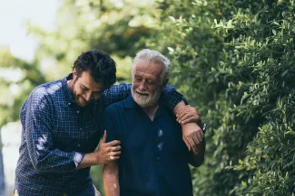 Young man walking with his father