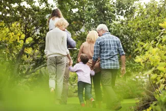 Multiple generations of the same family walking together