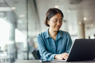 Older woman working at desk