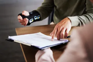 Injured man pointing at a document 