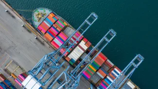 Ship being unloaded in port