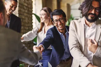 Clean energy business meeting shaking hands for joint venture