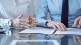 Two people looking over documents