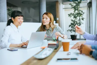 Business meeting at table people talking