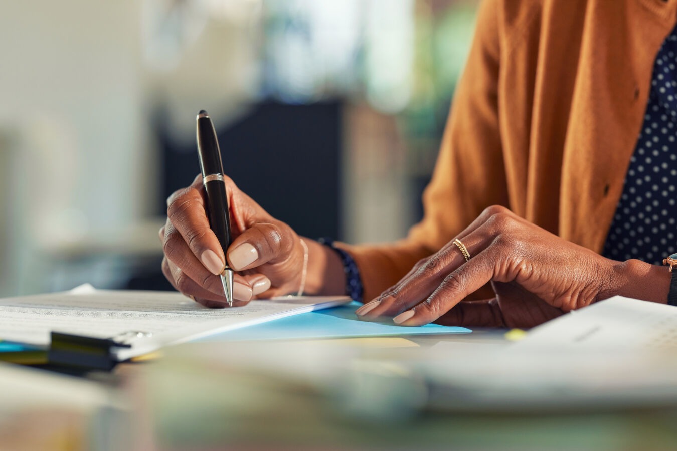 Woman signing document