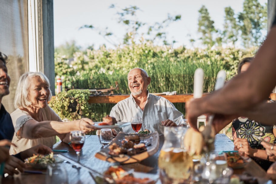 Group of people having dinner party outside