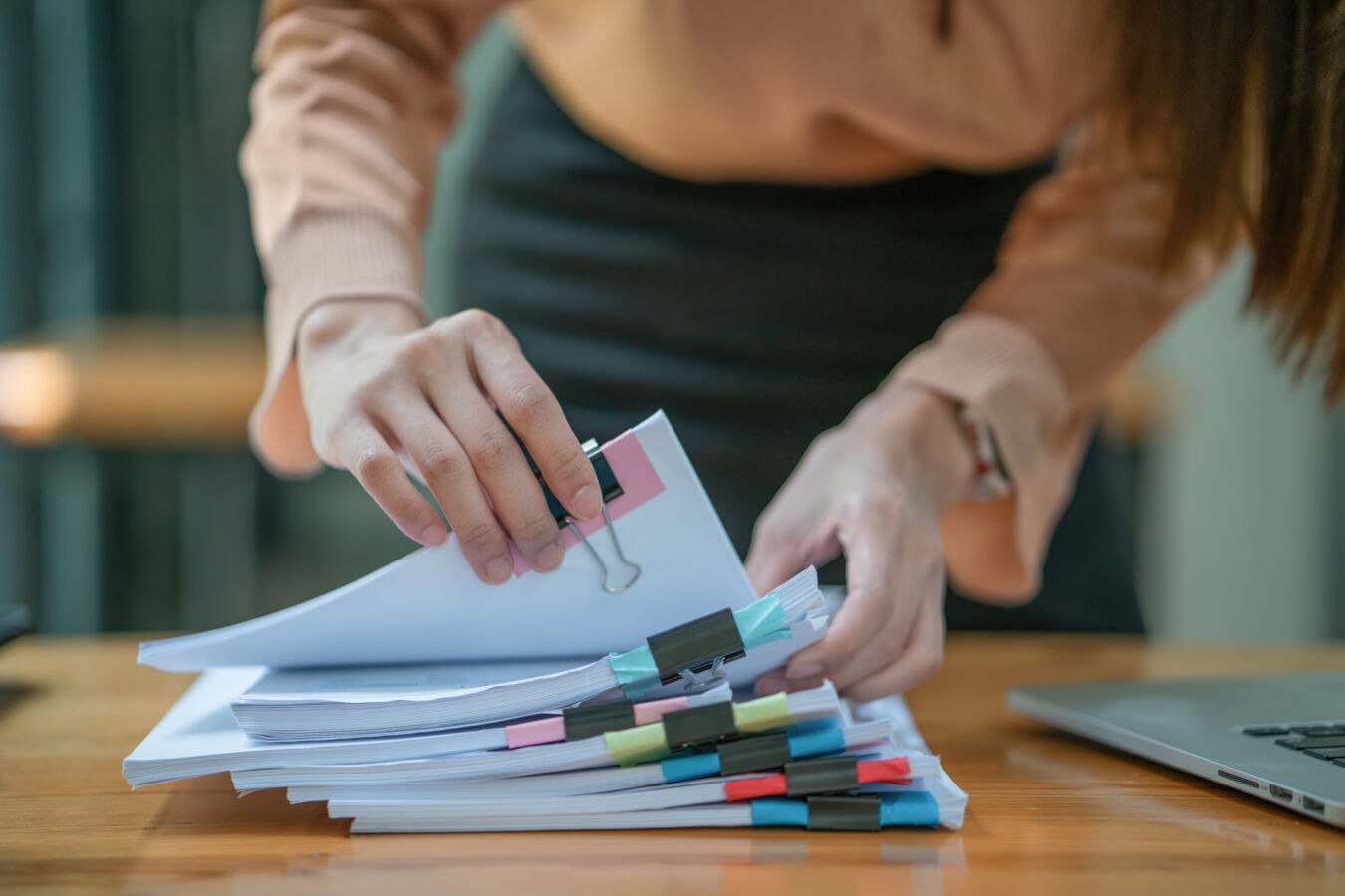 Woman with stack of legal paperwork
