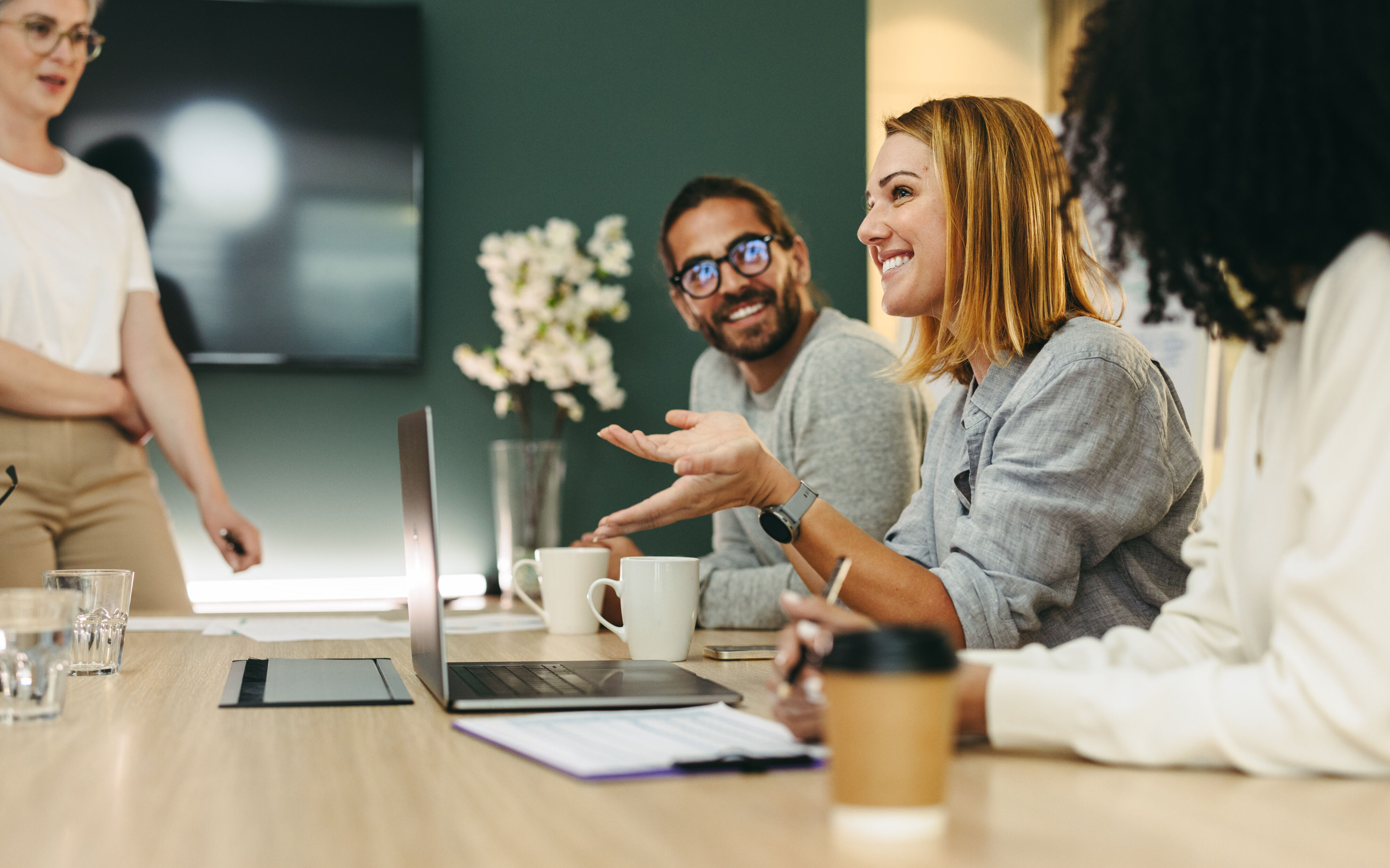 Woman speaking in team meeting