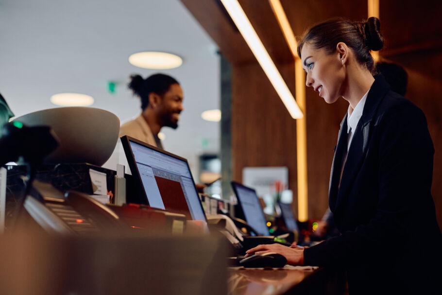 Hotel worker at reception desk