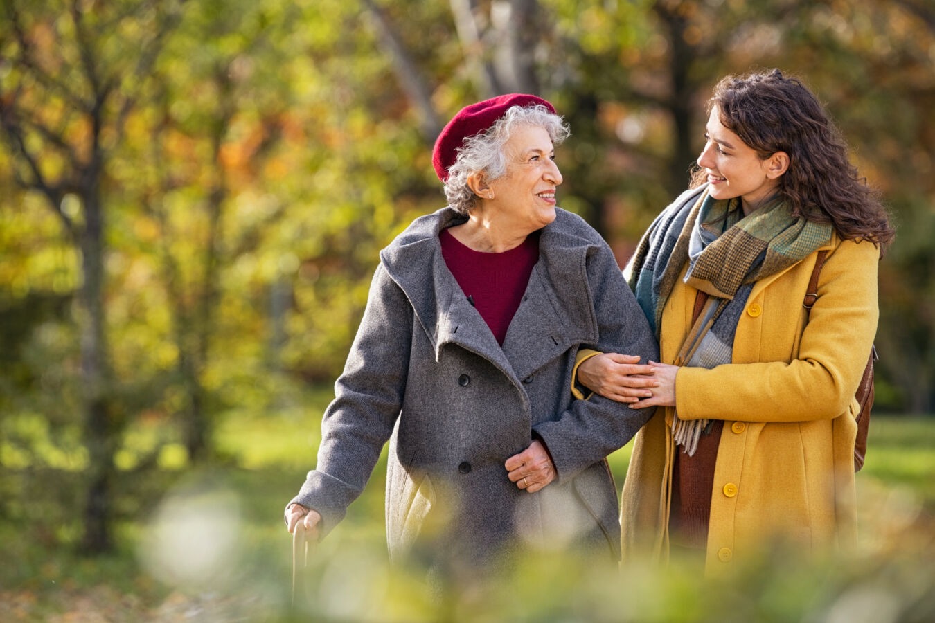 Younger woman walking with her grandmother