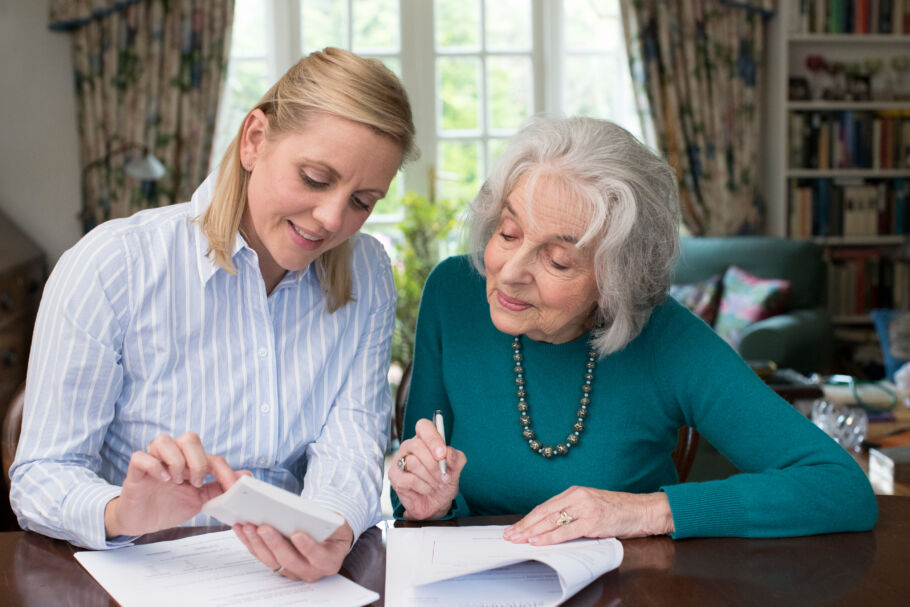 Mother and daughter looking at documents