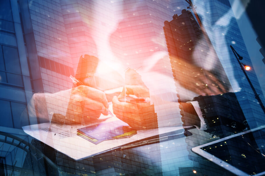 Graphic with a computer and person signing a document