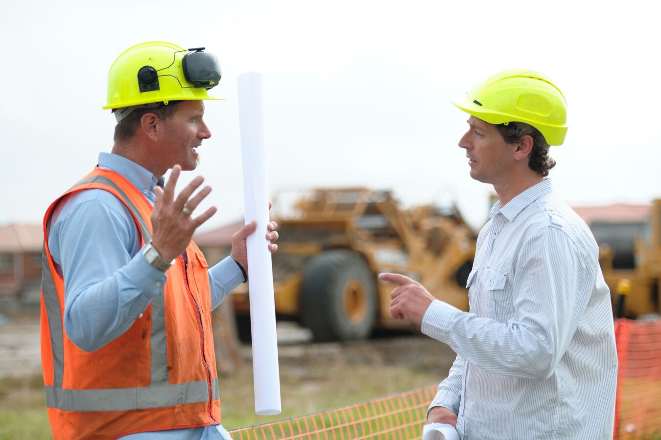 Construction workers discussing