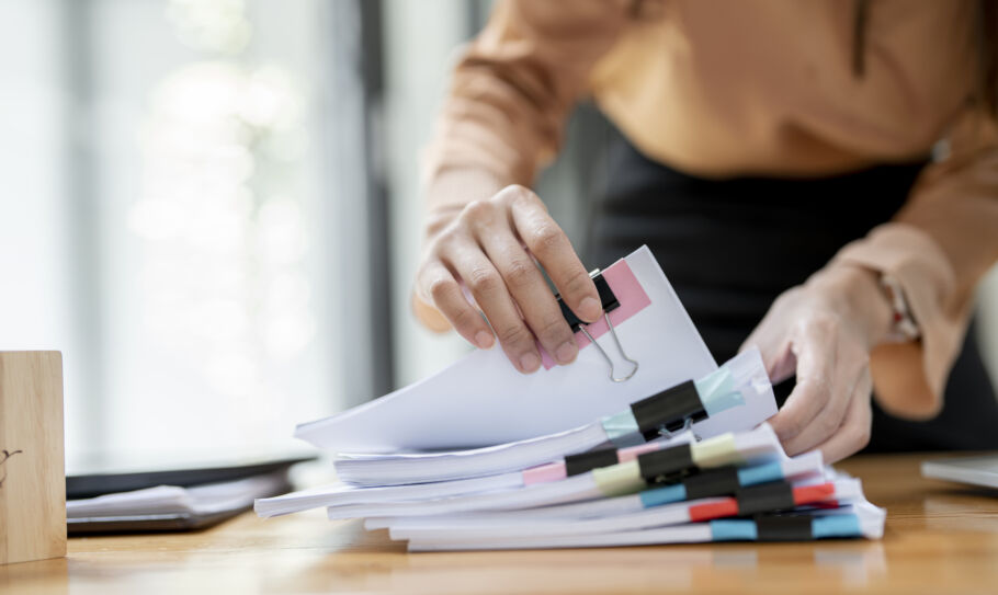 Woman flipping through paperwork