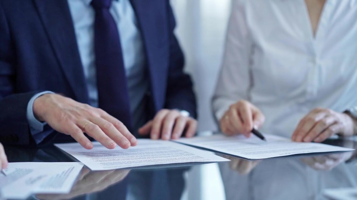 Two lawyers going over paperwork
