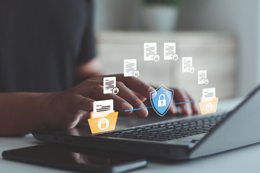 Cyber security data protection graphic man at laptop accessing files