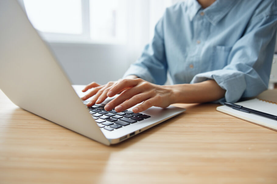 Woman typing on computer