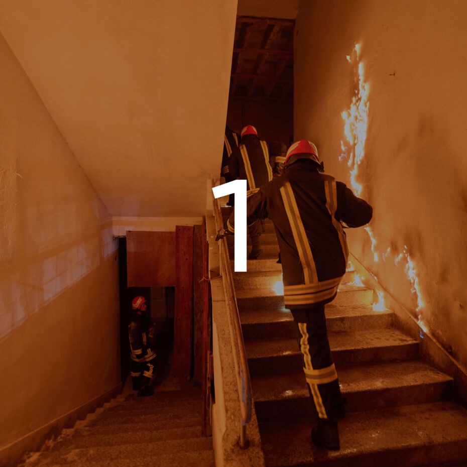 Firefighters running through building on fire with graphic overlay