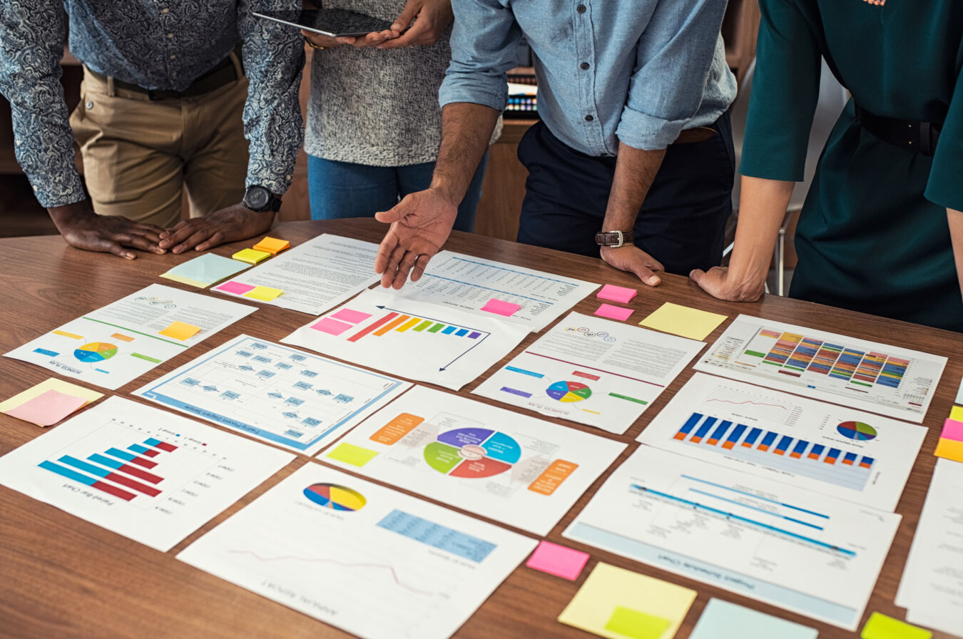 Team of people looking at graphs