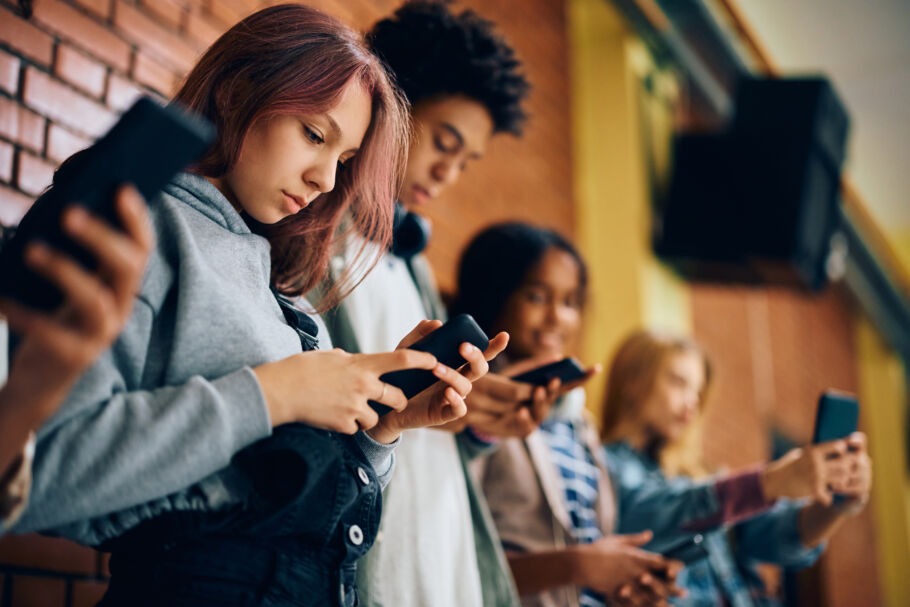 Teenagers using phones