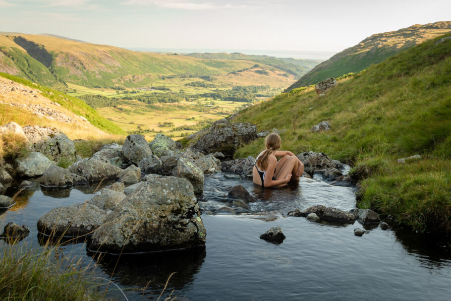 Woman wild swimming in Lake District