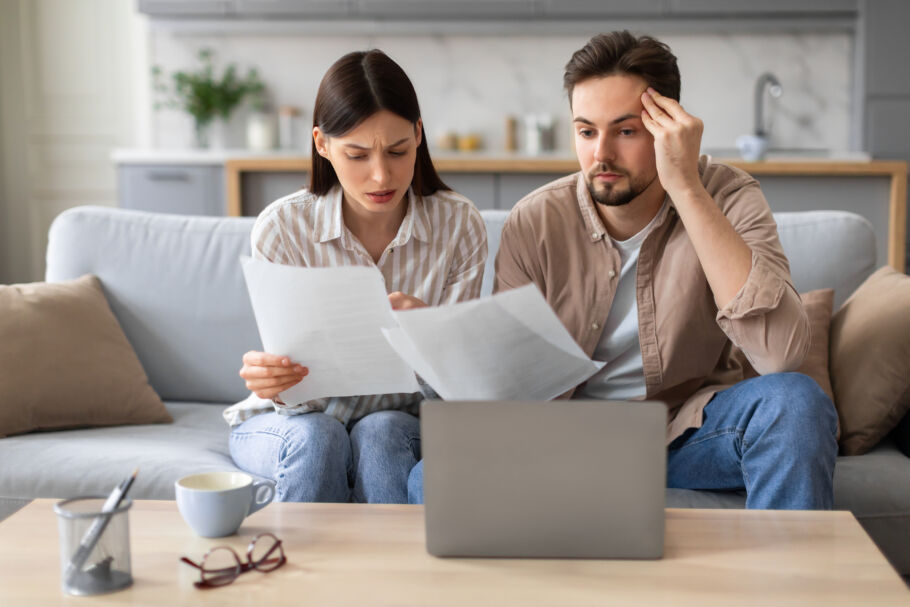 confused couple reading documents