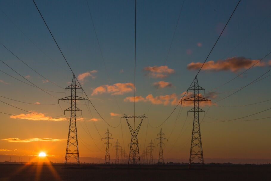 Electricity pylons in the countryside at sunset